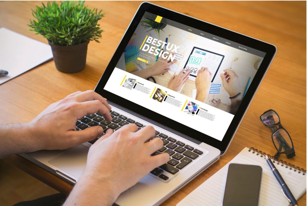 Graphic design services creating UI UX design and modern website layouts on laptop