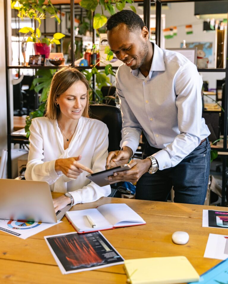 Digital marketing team discussing website design, SEO services, Google Ads, and social media marketing strategies for business growth.